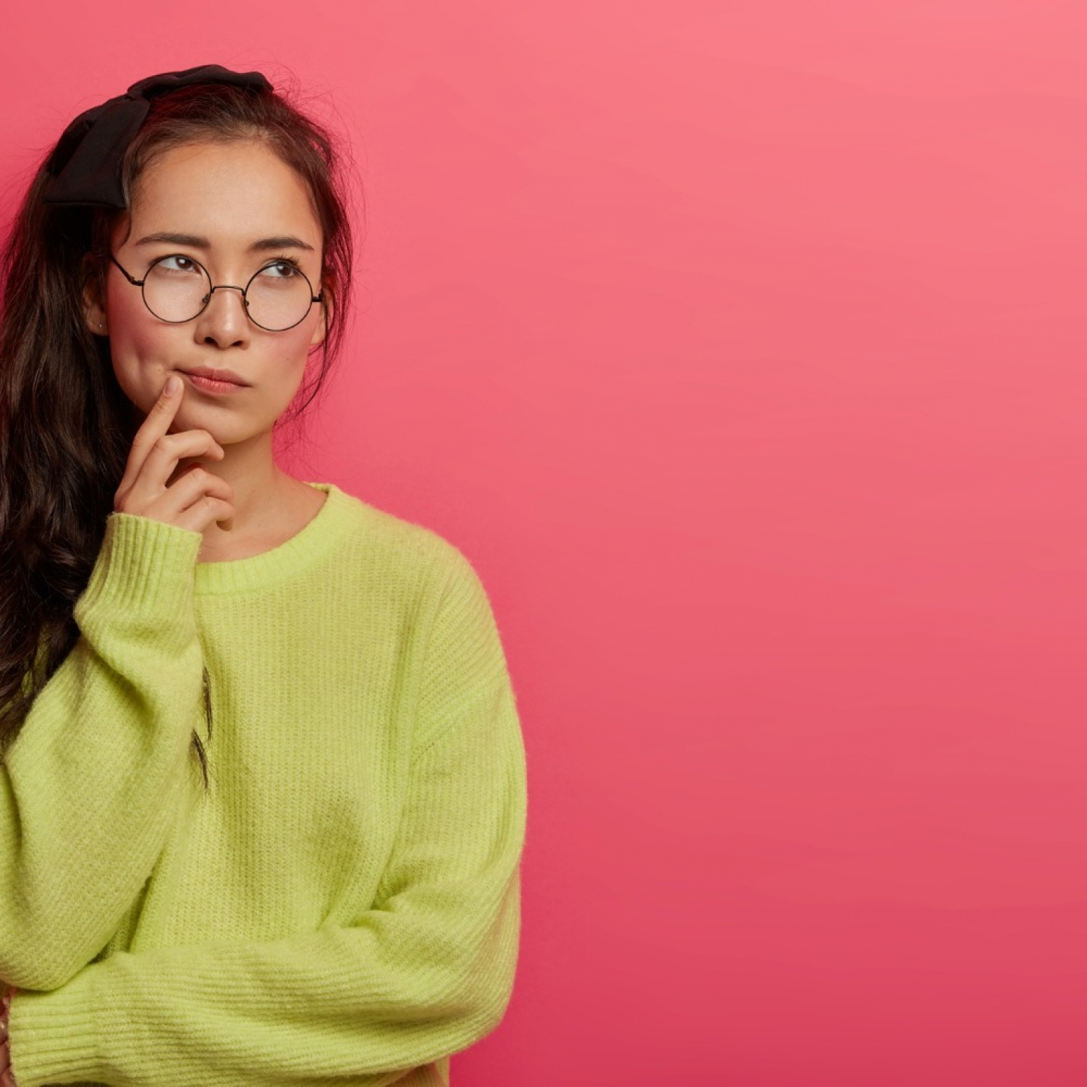 contemplative-female-looks-seriously-pensively-aside-purses-lips-concentrated-dressed-green-loose-jumper-makes-choice-mind