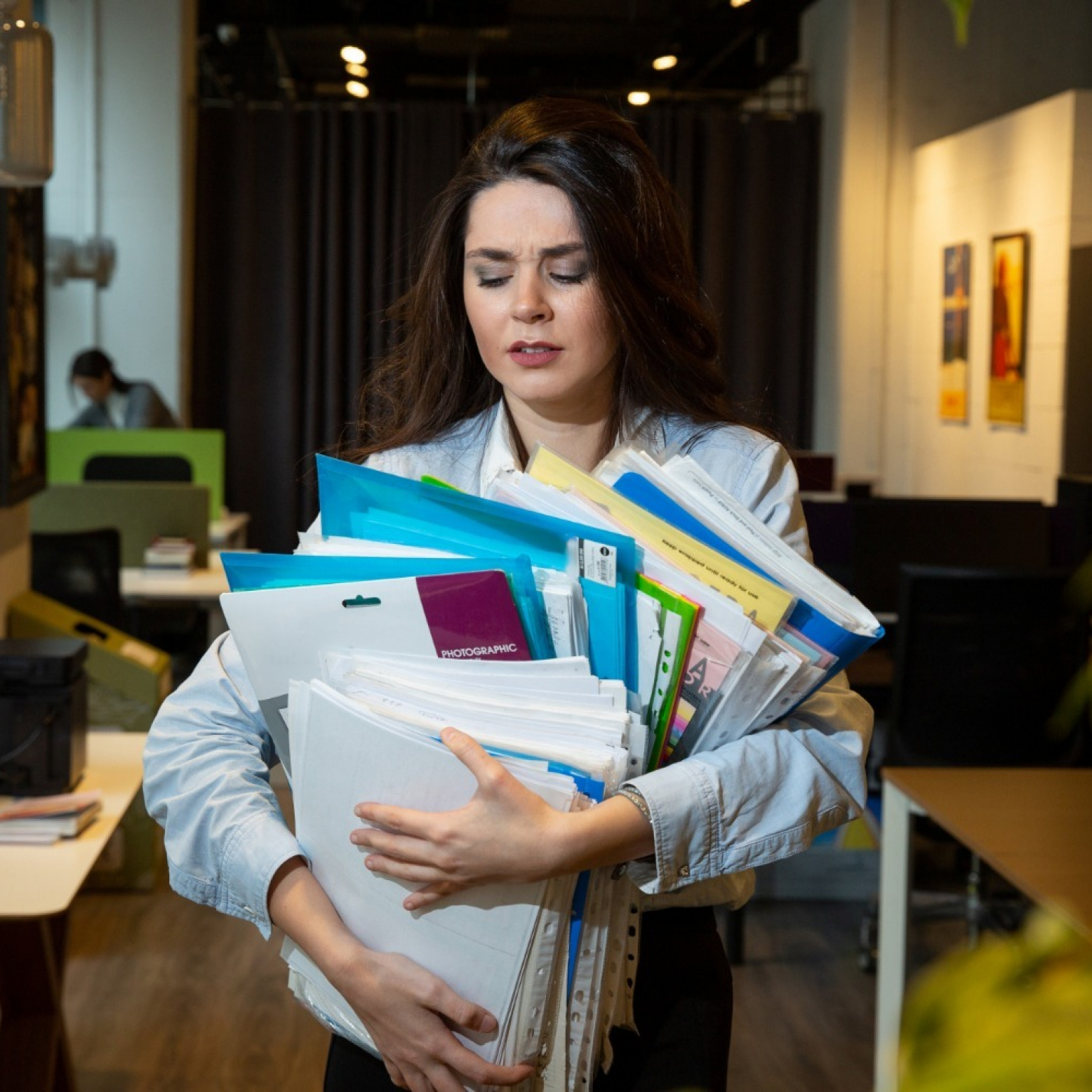 woman-holding-lots-folders