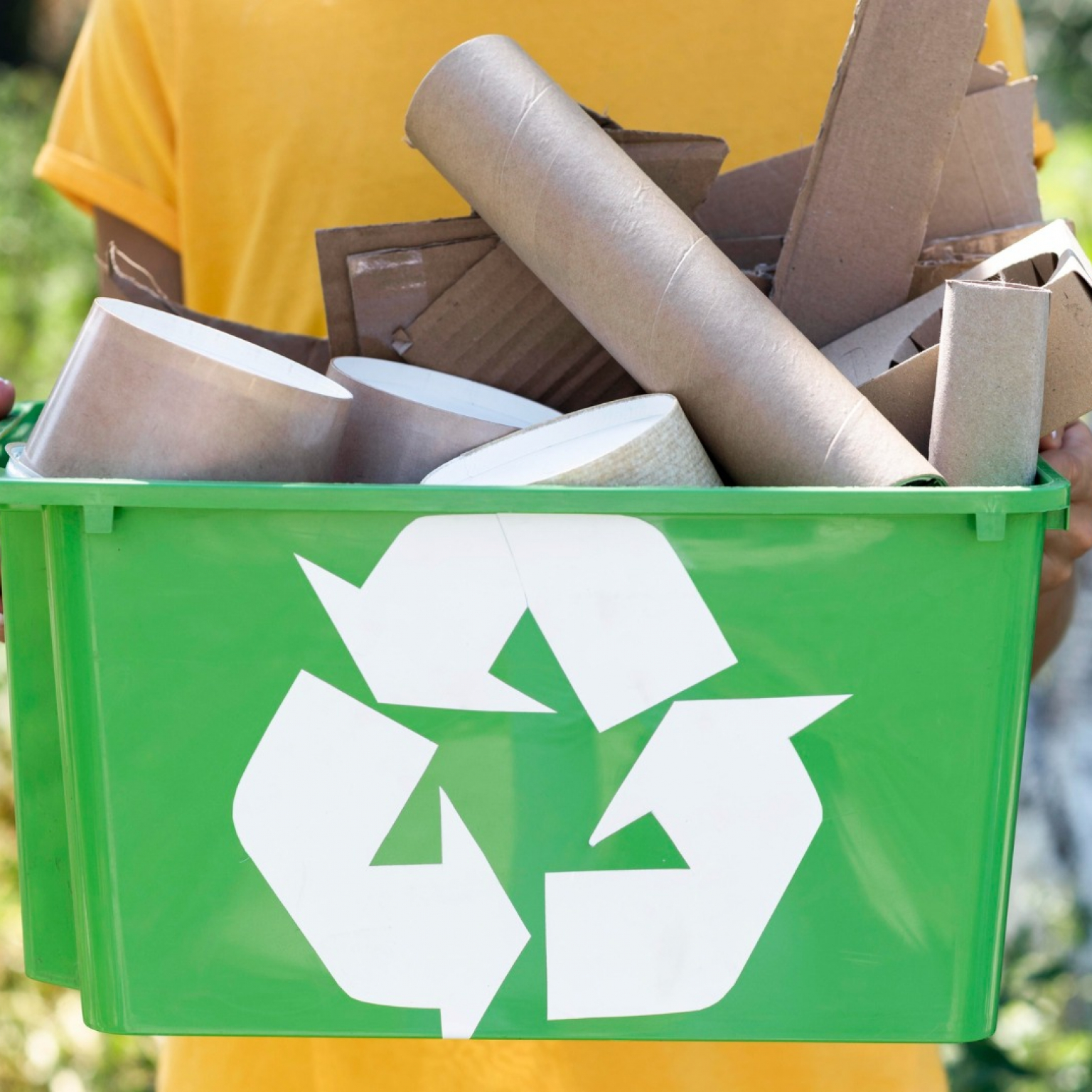 front-view-individual-holding-recycle-produts