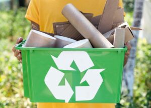 front-view-individual-holding-recycle-produts