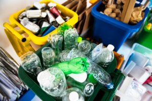 Junks being segregated into three different trash bins that can be included in the things that could be recycle