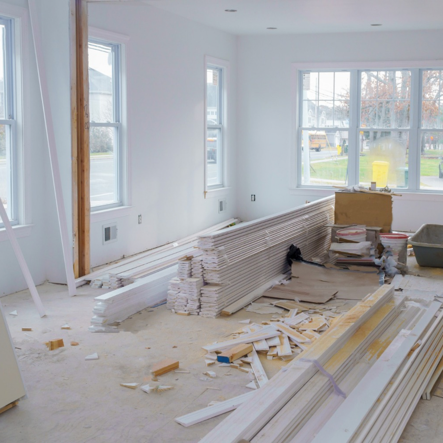 ongoing interior house renovation project with construction materials and some debris inside to be cleaned-up after the renovation