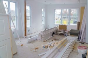 ongoing interior house renovation project with construction materials and some debris inside to be cleaned-up after the renovation