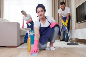 professional-cleaning-service-team-cleans-living-room-modern-apartment-top-spring-cleaning-tips