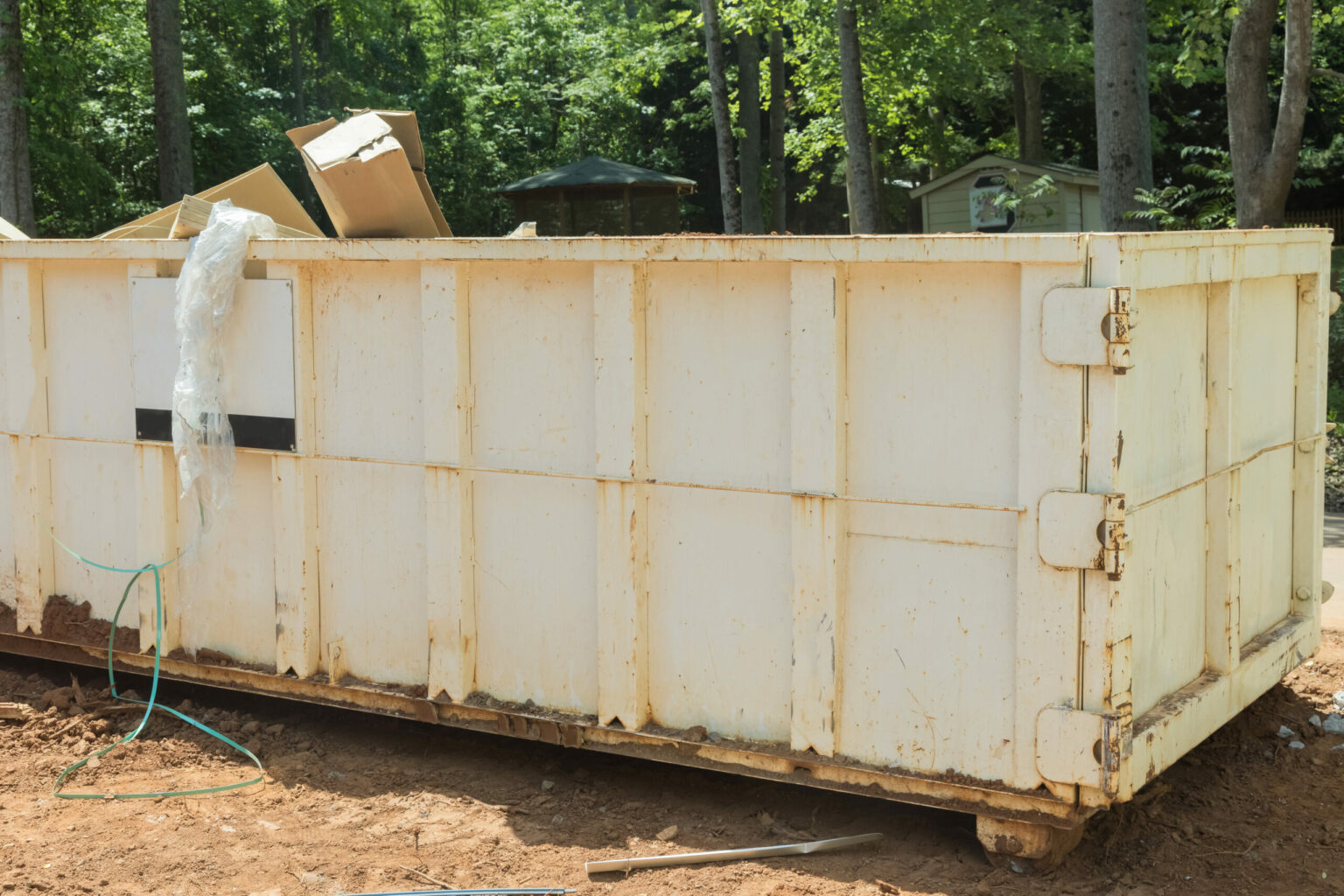 Construction trash dumpsters in a metal container, home house renovation.