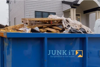 junk it dumpster bin in front of a residential house - residential dumpster bin for rent