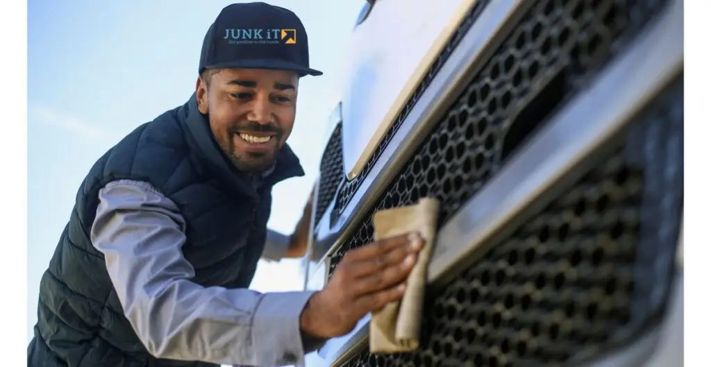 Junk It employee Cleaning Truck - learn more about the reasons why choose junk it dumpster rental services in canada