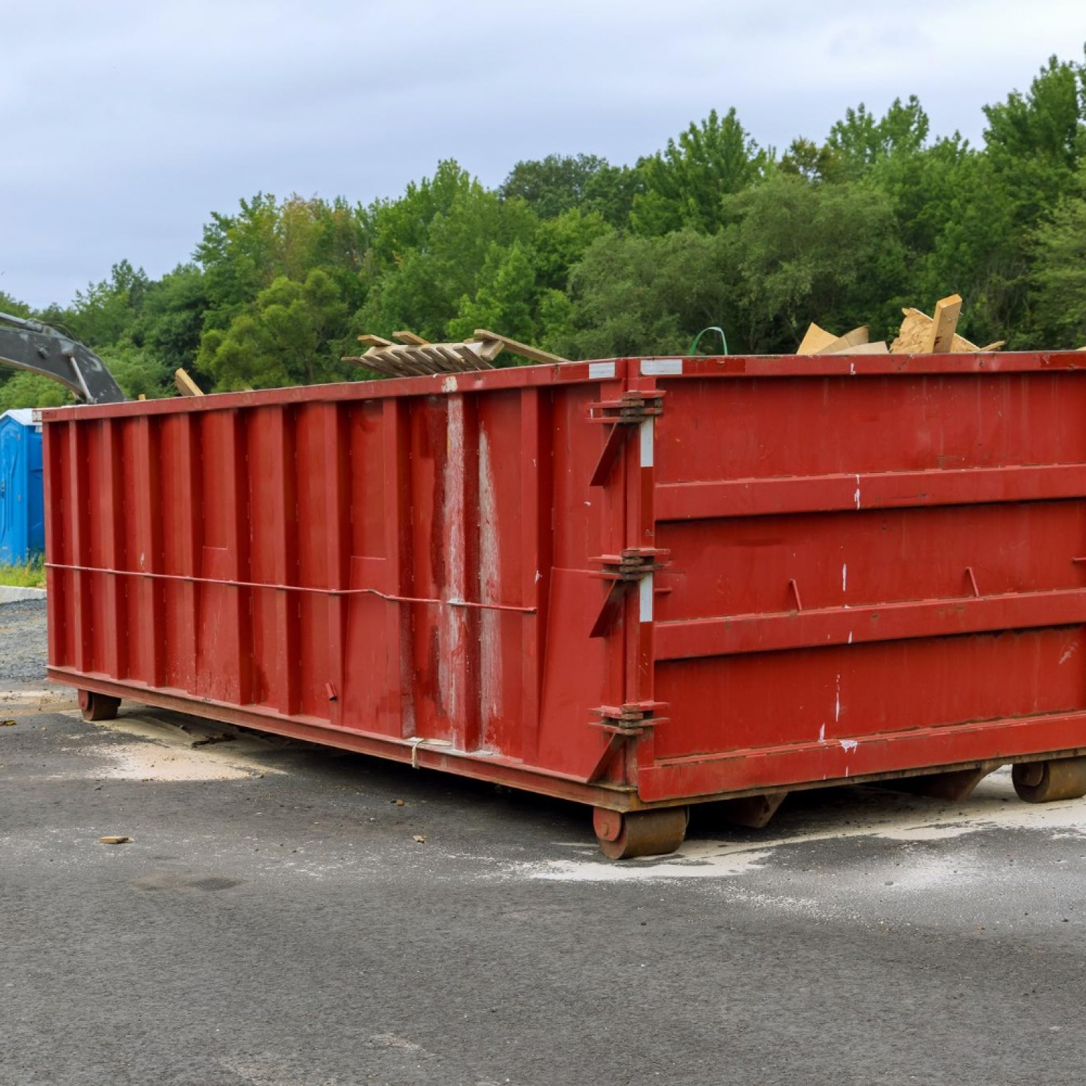 home-renovation-maintenance-loaded-dumpster-near-construction-site-to-select-a dumpster-rental-size