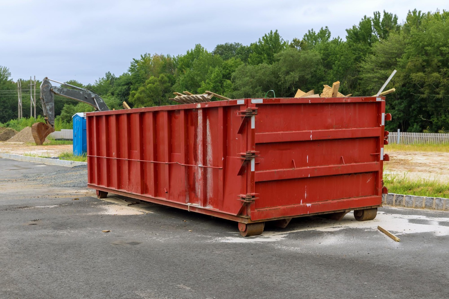 home-renovation-maintenance-loaded-dumpster-near-construction-site-to-select-a dumpster-rental-size