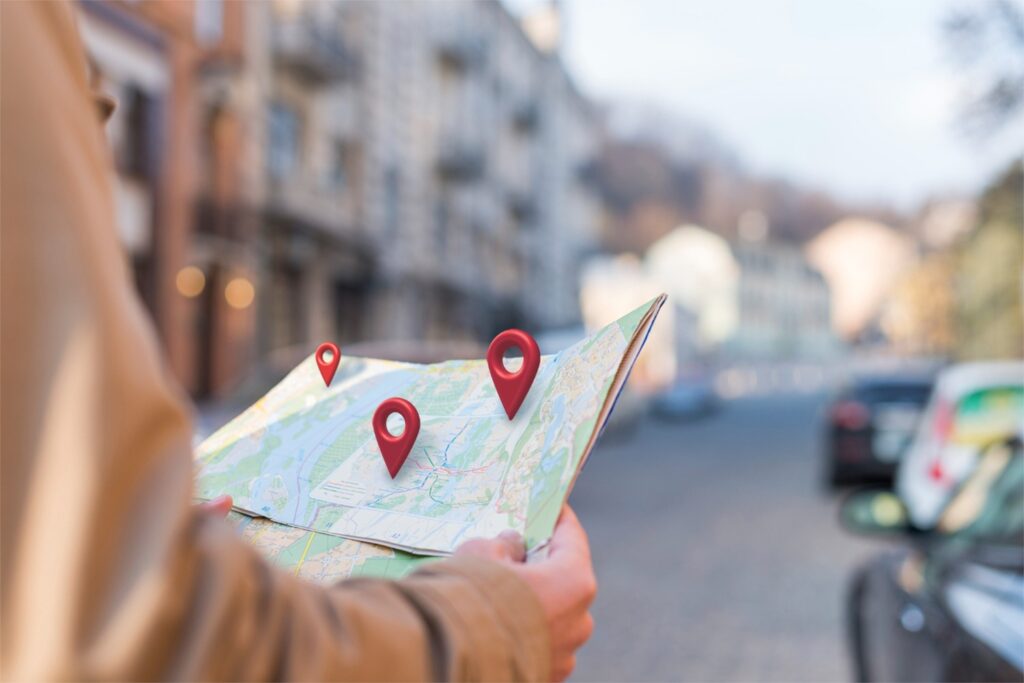 holding a map - find Junk It's dumpster rental locations in Canada