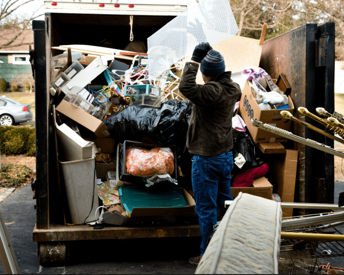 A man worrying about the pile of garbage. If you're in the same situation, get stress-free solutions with bin rental services in Brampton