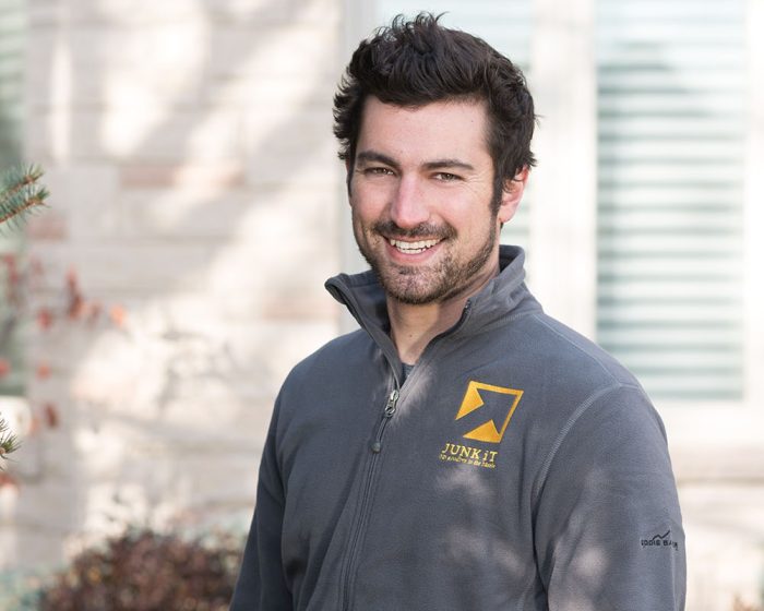 junk it employee smiling - be happy too if you choose junk it garbage/dumpster rental services in London, Ontario