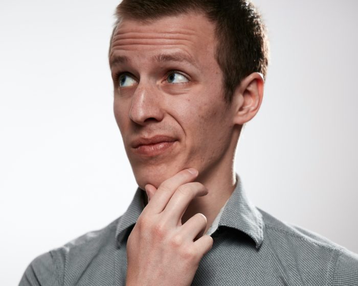 a man thinking about his waste management needs - Consider Junk It's bin rental in Cambridge for a convenient solution