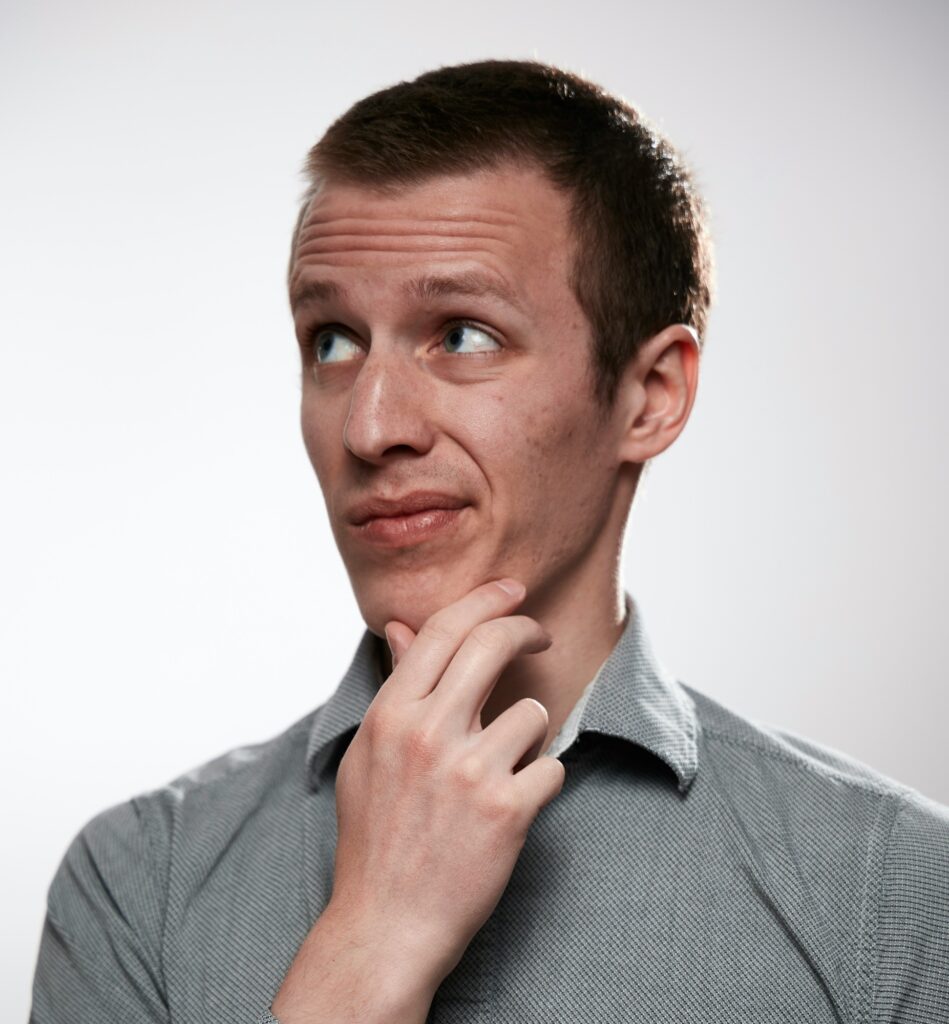 A man thinking - considering the benefits of garbage bin rental in Toronto for efficient waste management