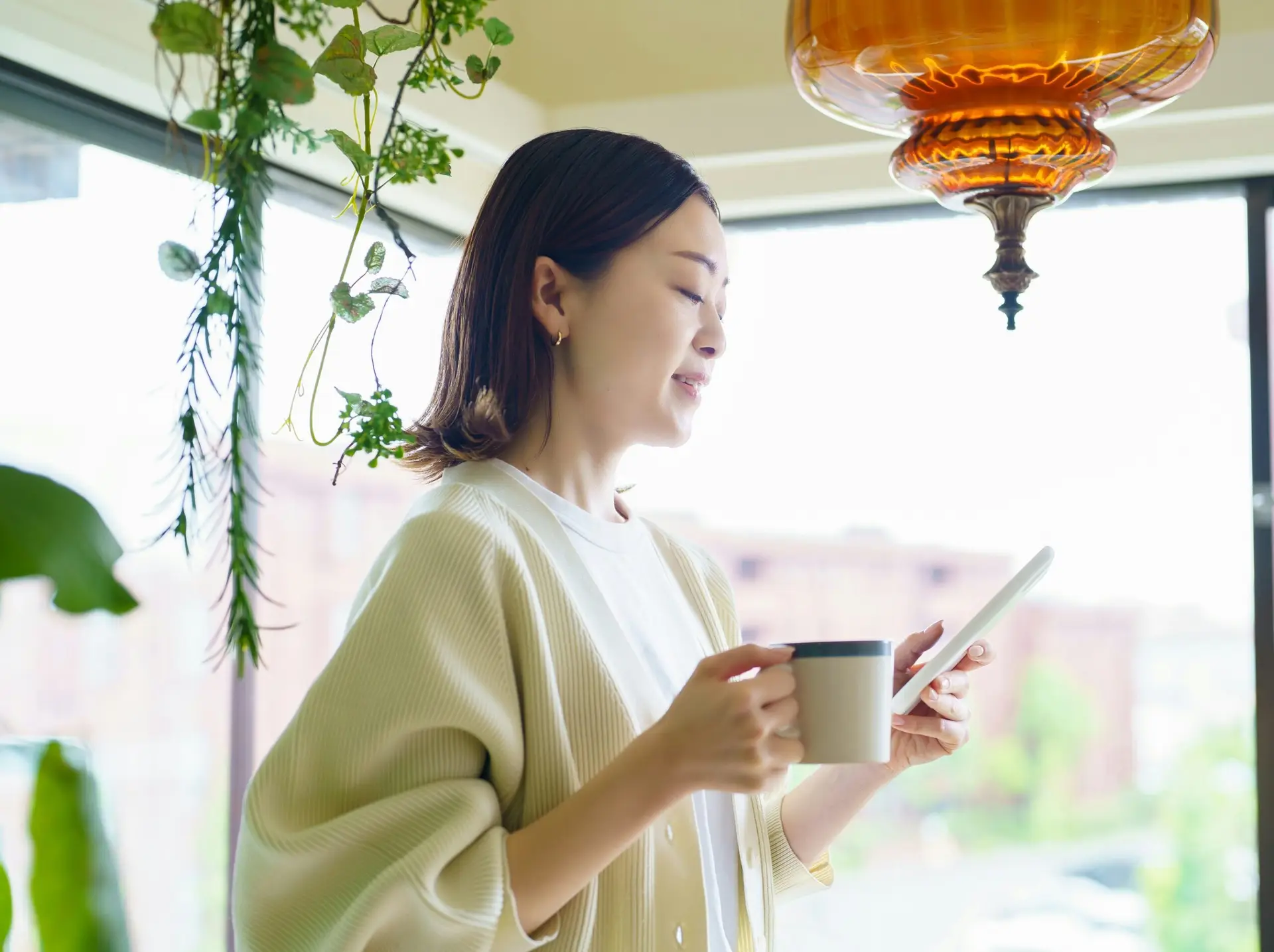 A woman using her phone, effortlessly finding the best options for bin rental in Kitchener to make her cleanup easier.
