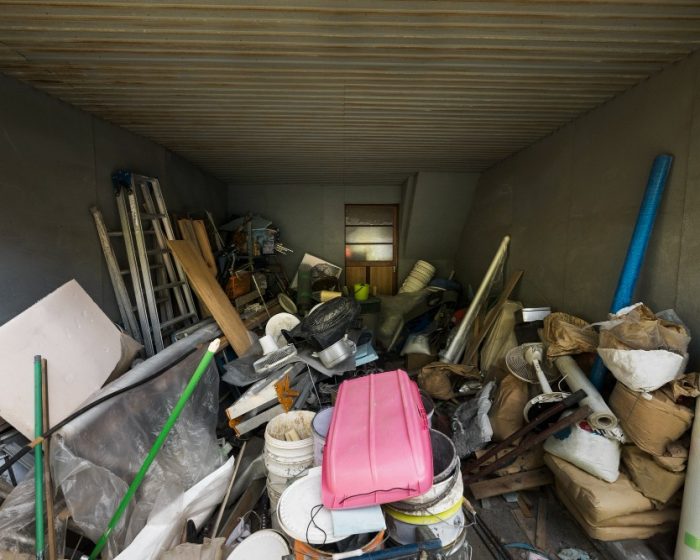 A room filled with unused construction junk and old household clutter, ready to be cleared away with convenient bin rental in Guelph